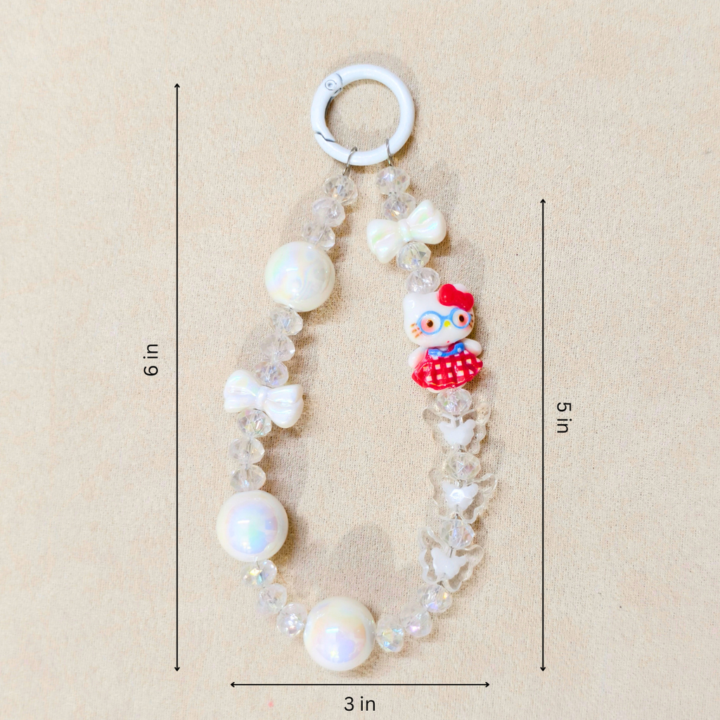 Baby teething necklace with white pearls and a cartoon character on a beige background