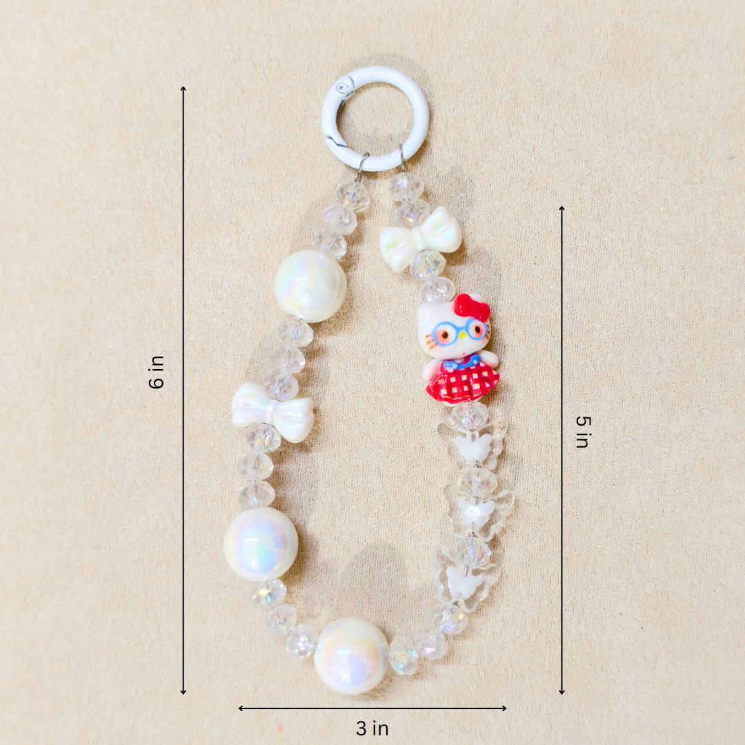 Baby teething necklace with white pearls and a cartoon character on a beige background