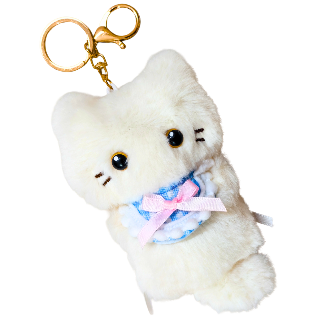 A white plush cat keychain charm with a gold clasp, featuring embroidered black whiskers and eyes, and wearing a blue and pink ruffled ribbon collar.