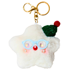 A fluffy white star-shaped keychain charm with a gold clasp, featuring light blue glasses, a red nose, small pearl-like accents, a green knit hat, and a red pom-pom, shown on a plain white background.