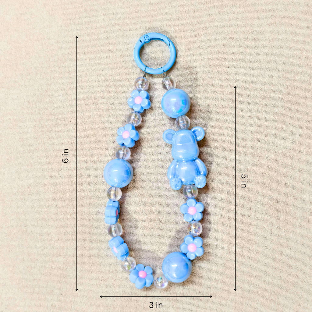 Blue baby teething necklace with measurements on a beige background