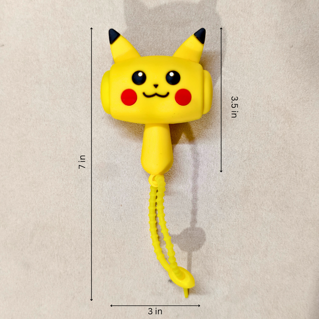 Yellow Pikachu-themed wall hook with ear tips, black eyes, red cheeks, and a hanging loop, shown on a beige wall with dimension lines and text indicating 7 in height, 3.5 in ear-to-ear width, and 3 in hook-tip width.