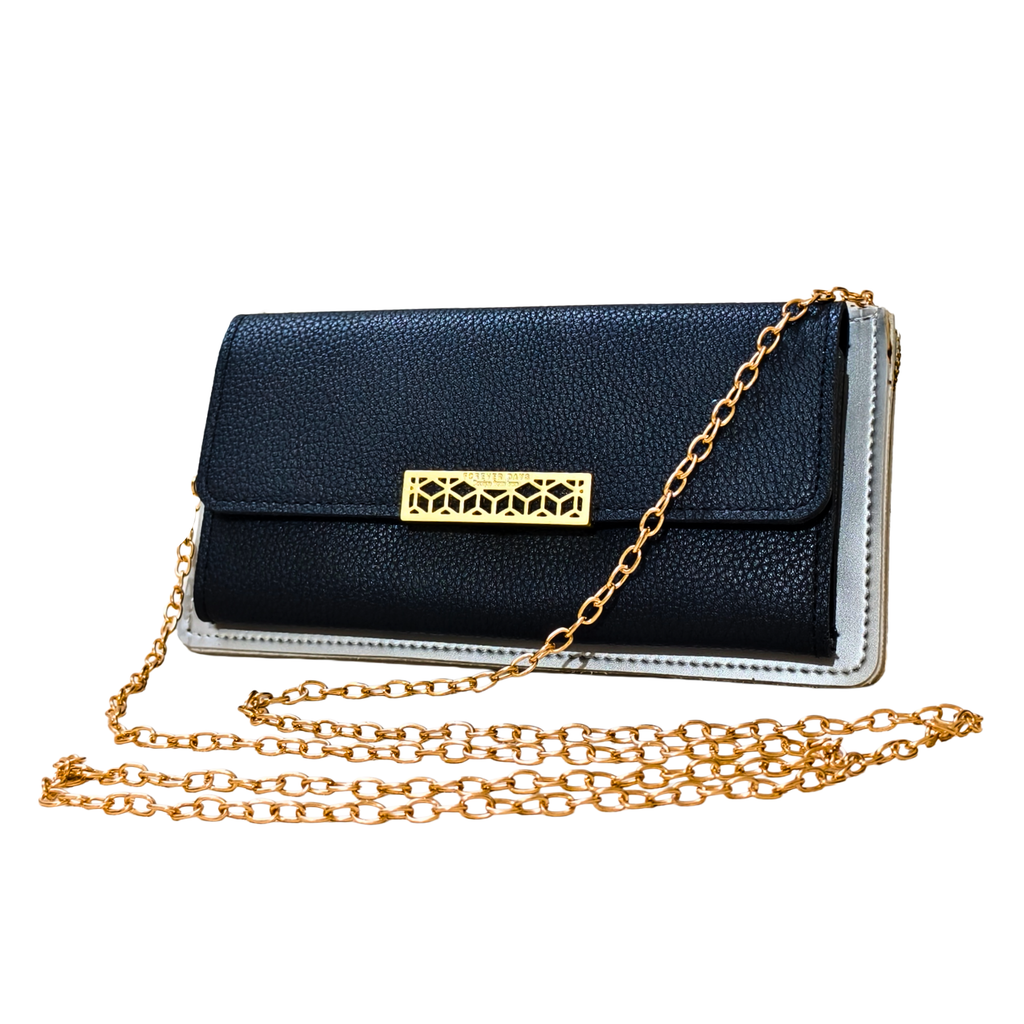 Black clutch bag with gold chain on a white background