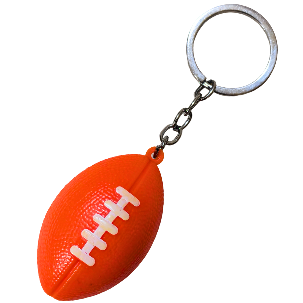 An orange football-shaped keychain with white laces and a silver metal key ring and chain, shown on a plain white background.