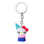 Keychain with a cartoon character wearing a blue hat and red bow on a white background