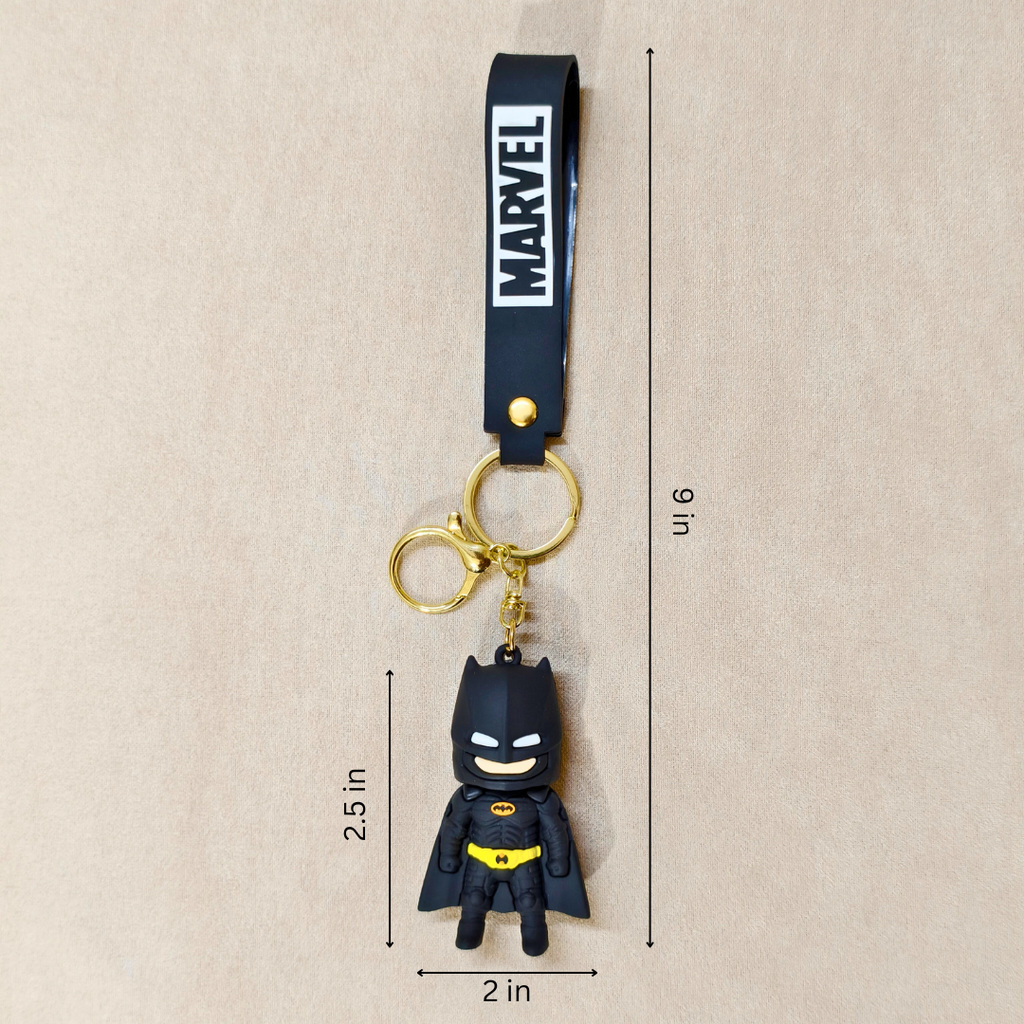 Batman keychain with Marvel logo on a beige background