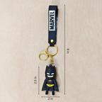 Batman keychain with Marvel logo on a beige background