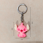 Pink cartoon character keychain with measurements on a beige background