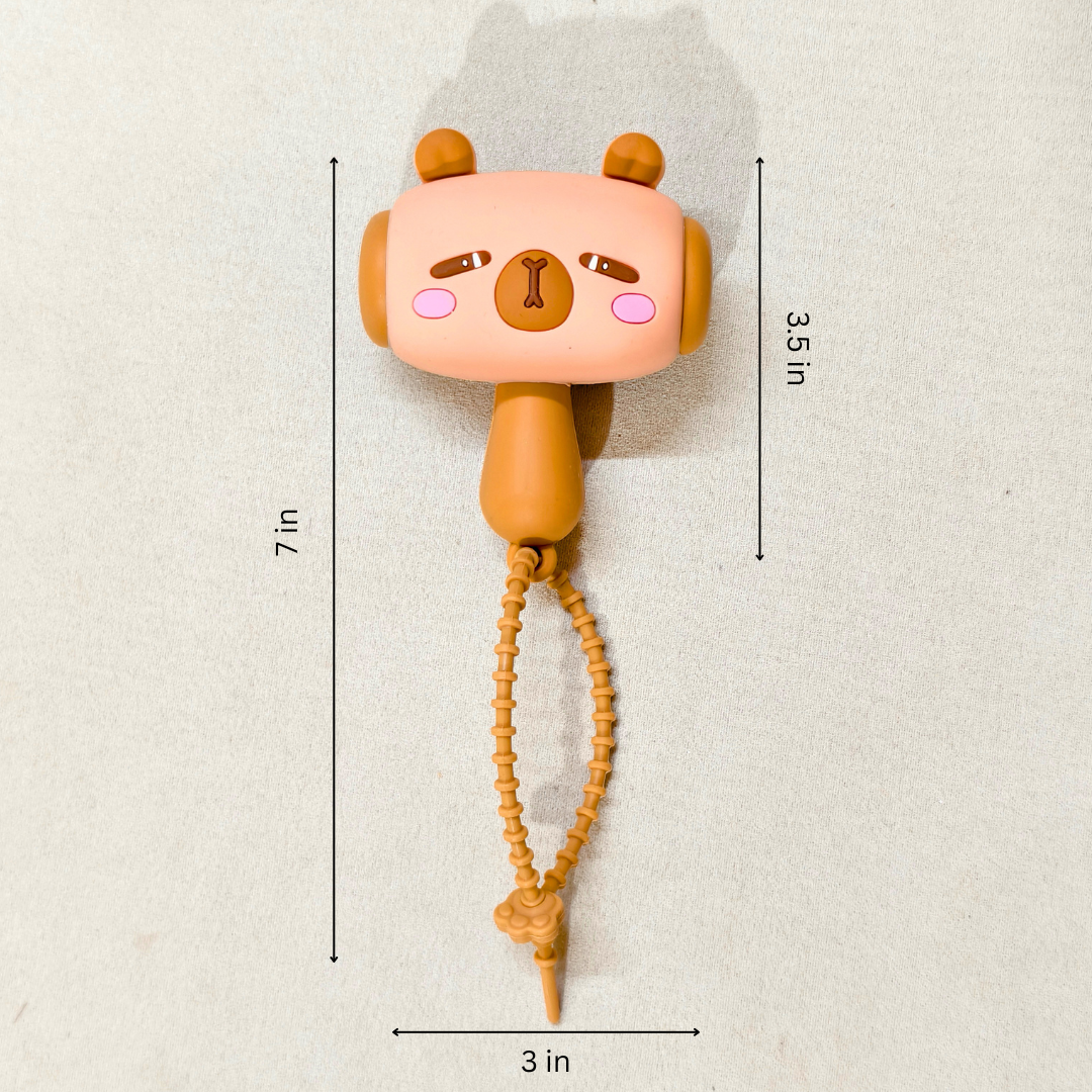 Cute animal-shaped toy with measurements on a light background
