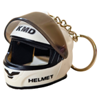 A miniature white and black full-face racing helmet keychain with a translucent visor, gold-tone chain, and split key ring, featuring 'KMD' and 'HELMET' text.