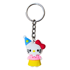 Keychain with a cartoon character wearing a blue hat and red bow on a white background