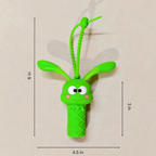 Green toy with measurements on a beige background