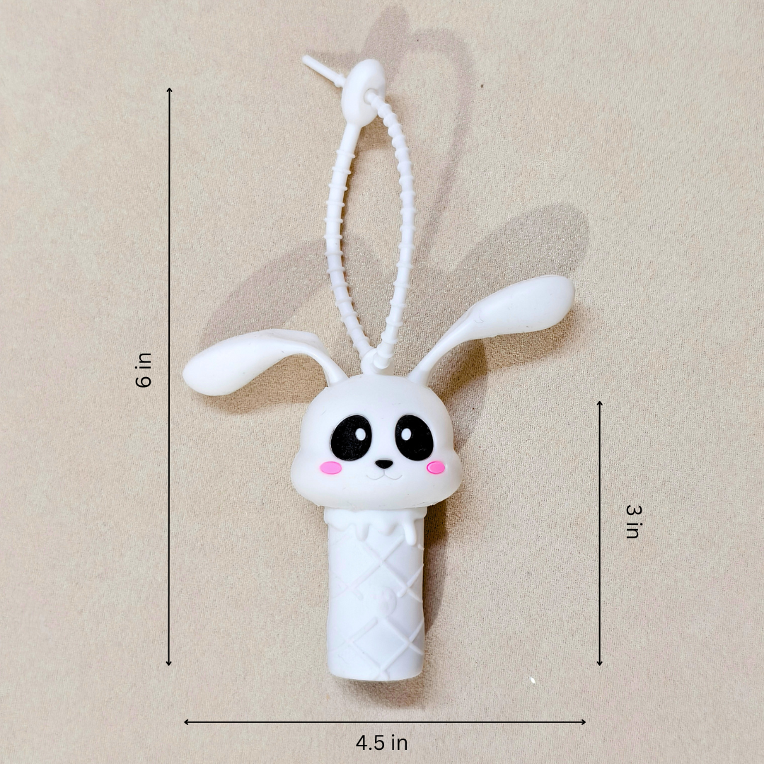 White bunny-shaped toy with measurements on a beige background