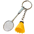 silver metal badminton racket keychain with a small pink and white plastic shuttlecock attached, against a plain white background.


