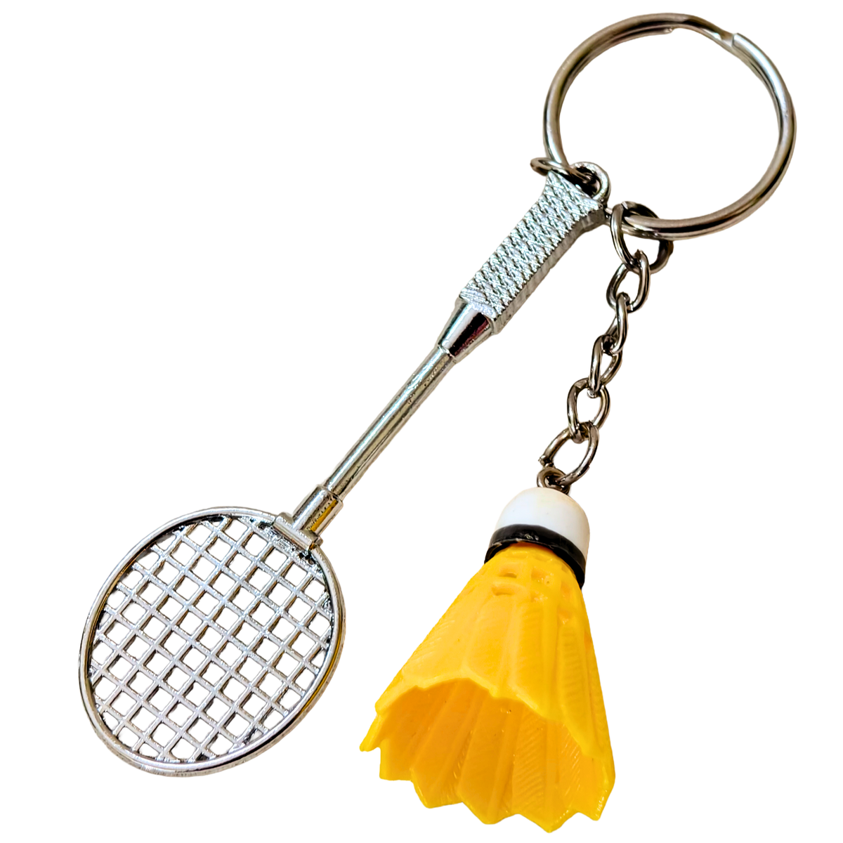 silver metal badminton racket keychain with a small pink and white plastic shuttlecock attached, against a plain white background.


