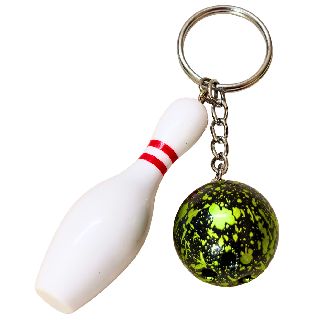 A novelty bowling keychain  featuring a green and black mottled bowling ball and a white bowling pin with a red stripe, attached to a silver split ring on a plain white background.

Details