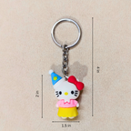 Keychain of a cartoon character with measurements on a beige background