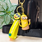 Yellow Character Minion Keychain Attached With Purse As Bag Charm On Beige Background.