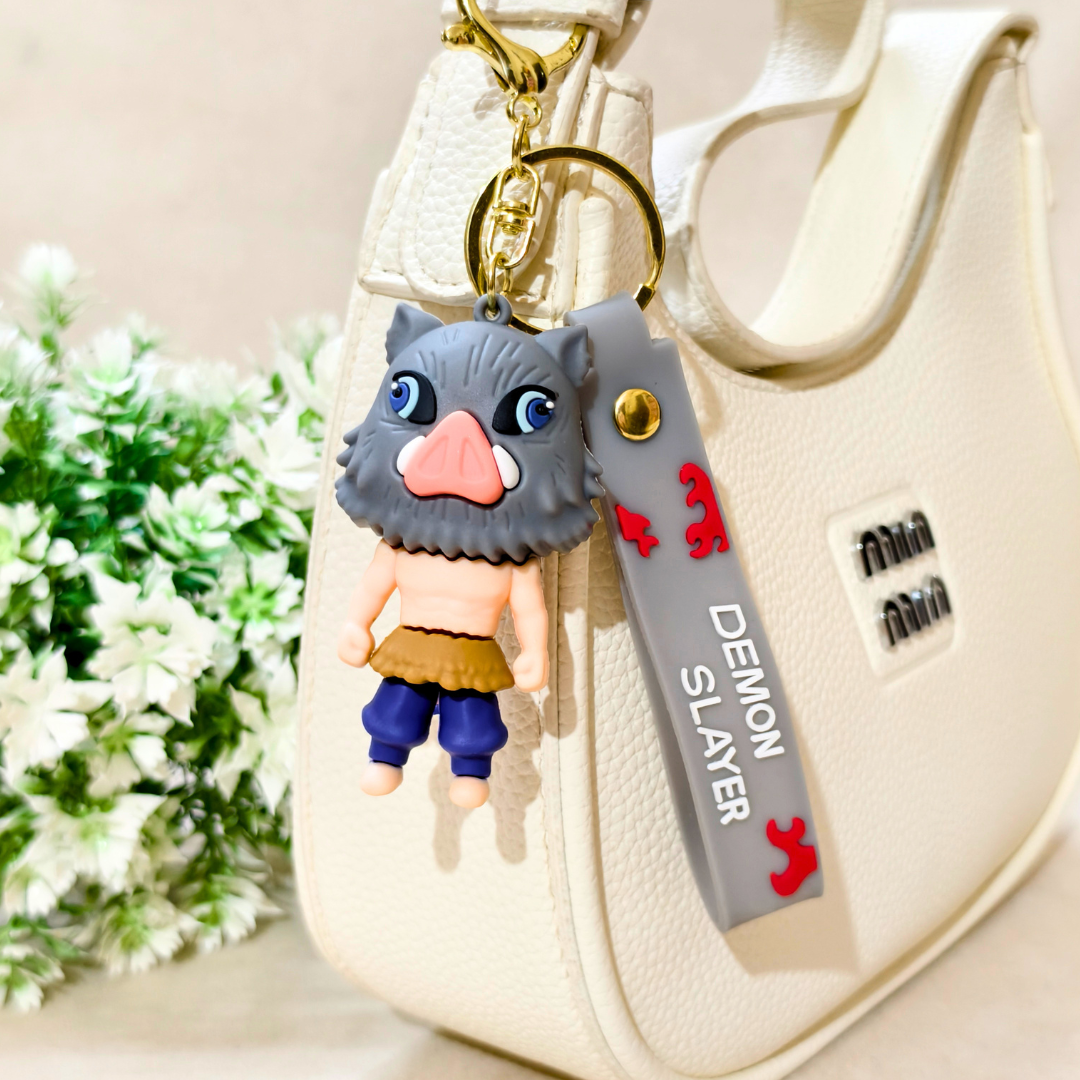 Keychain with a character from 'Demon Slayer' attached to a beige bag.