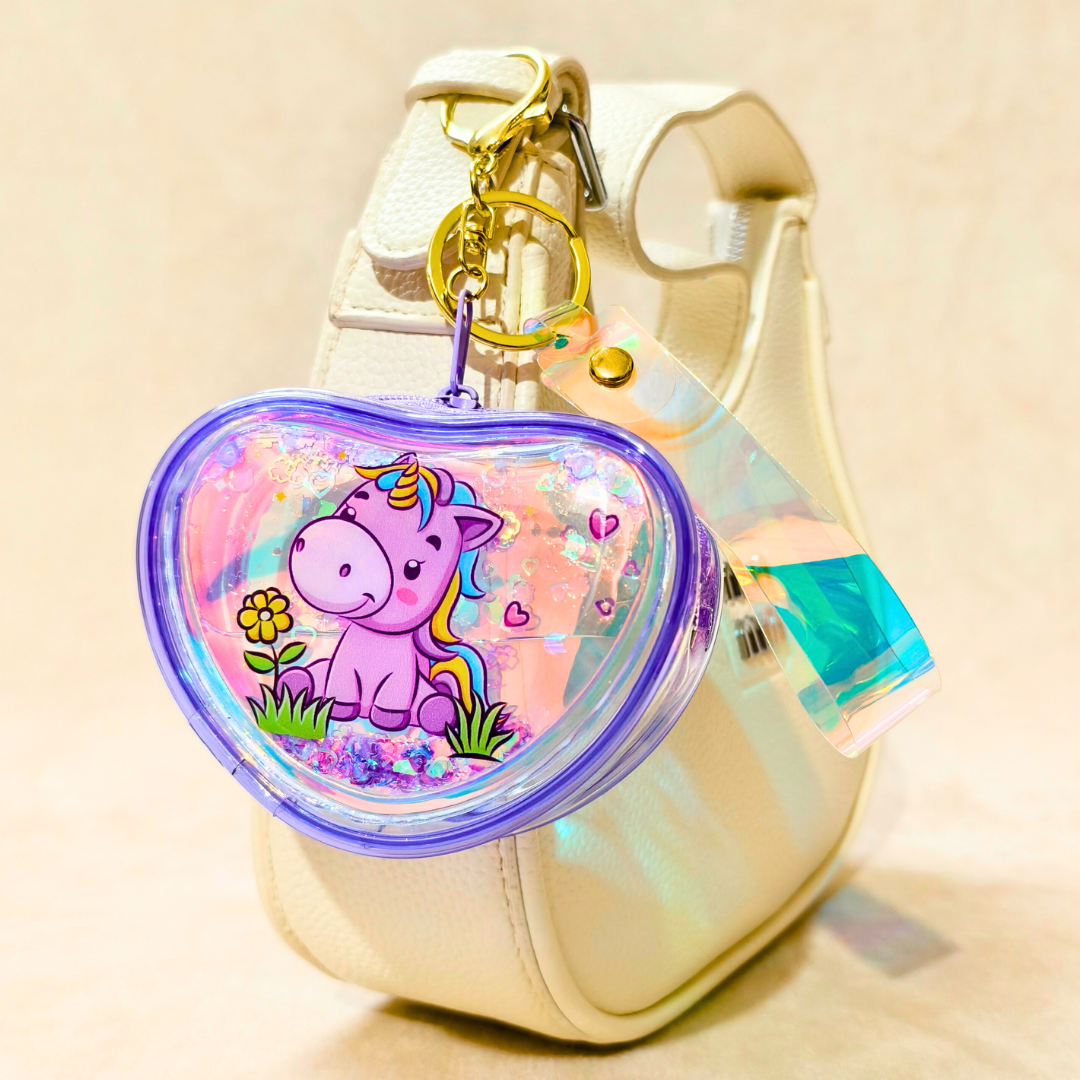 Heart-shaped keychain with a unicorn design on a beige background