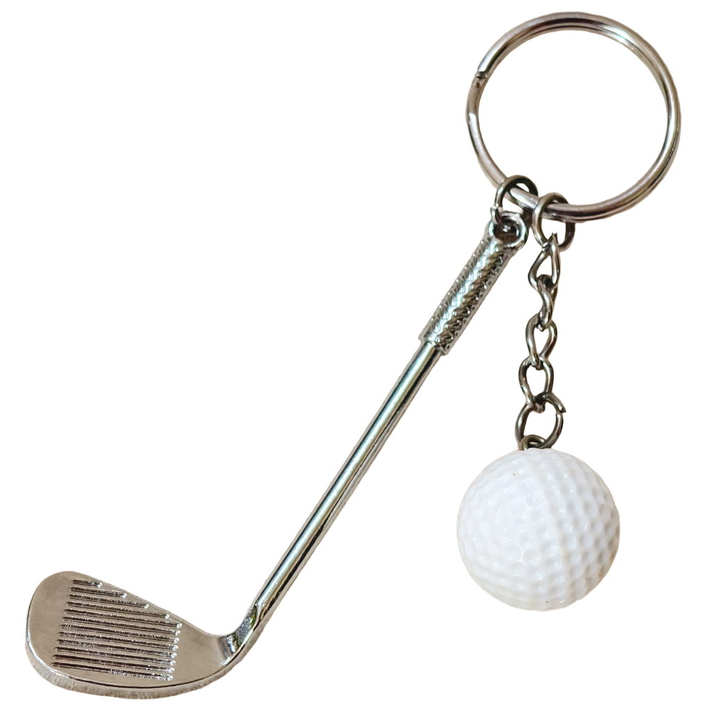 A novelty golf keychain featuring a miniature silver metal golf club head and shaft, a silver split key ring, a short chain, and a small white textured golf ball charm, shown on a plain white background.