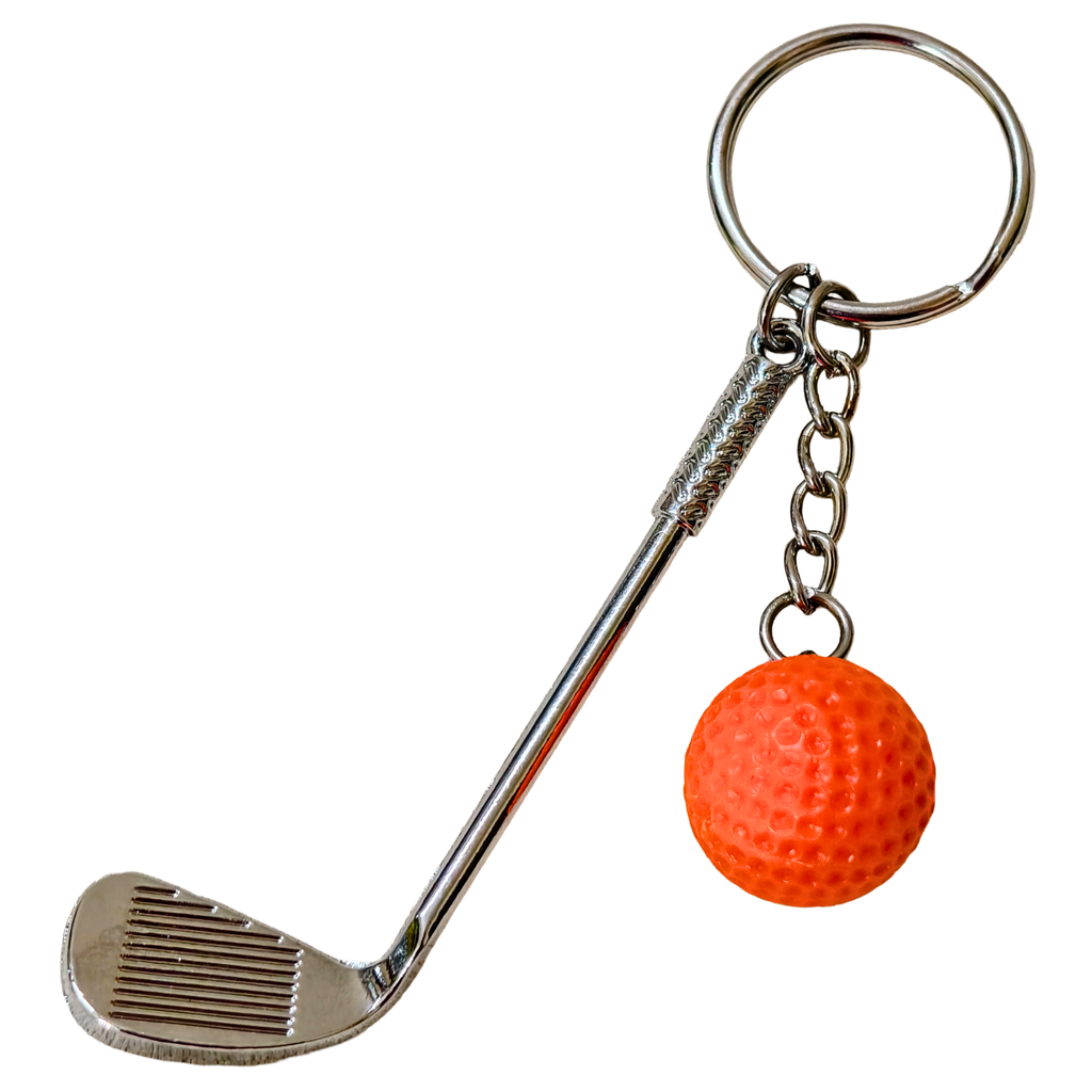 A novelty golf keychain featuring a miniature silver metal golf club head and shaft with a textured handle, attached to a silver split ring and chain, with an orange textured golf ball charm.