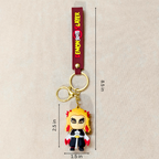 Keychain with character charm and measurement details on a beige background