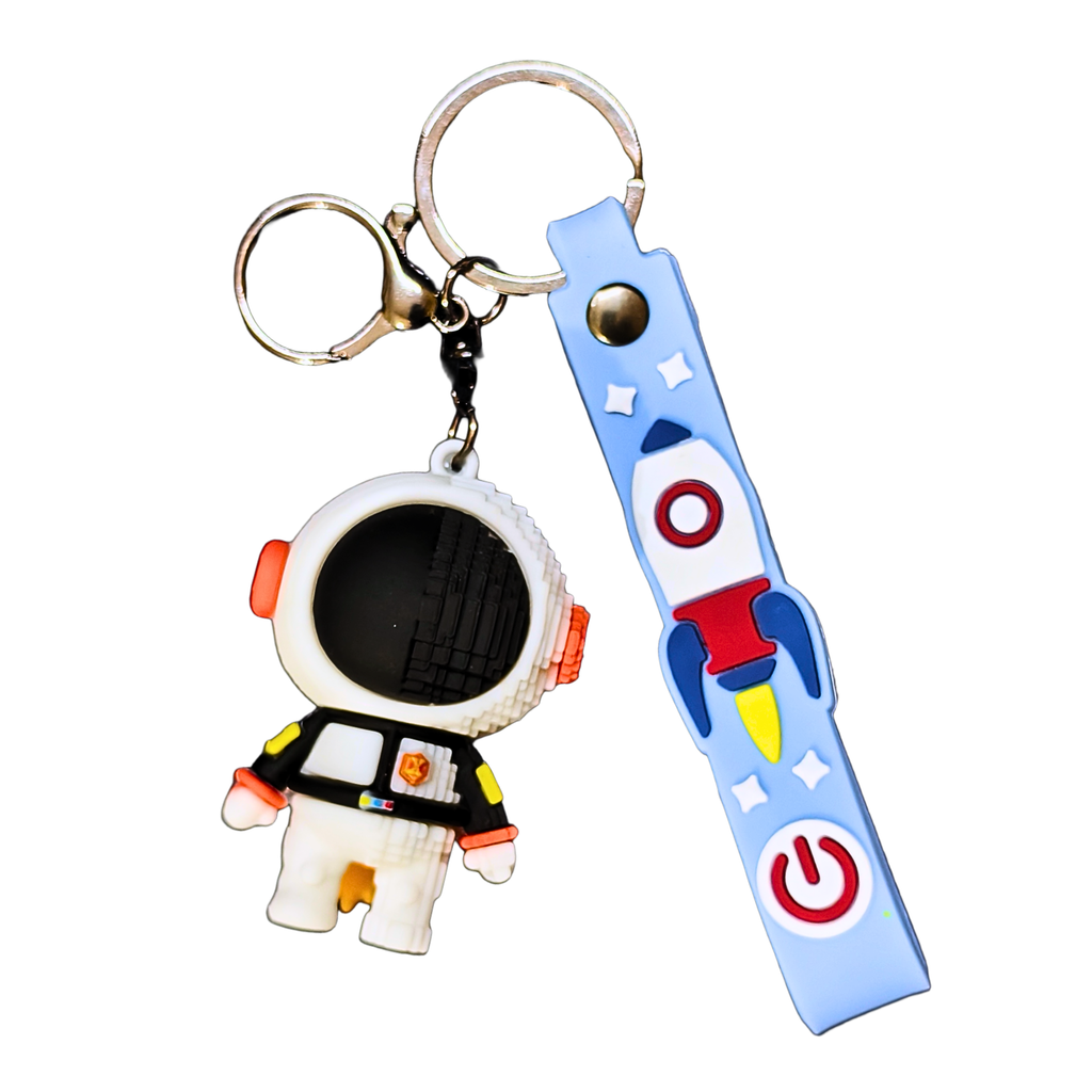 Keychain with astronaut figure and rocket design on a white background