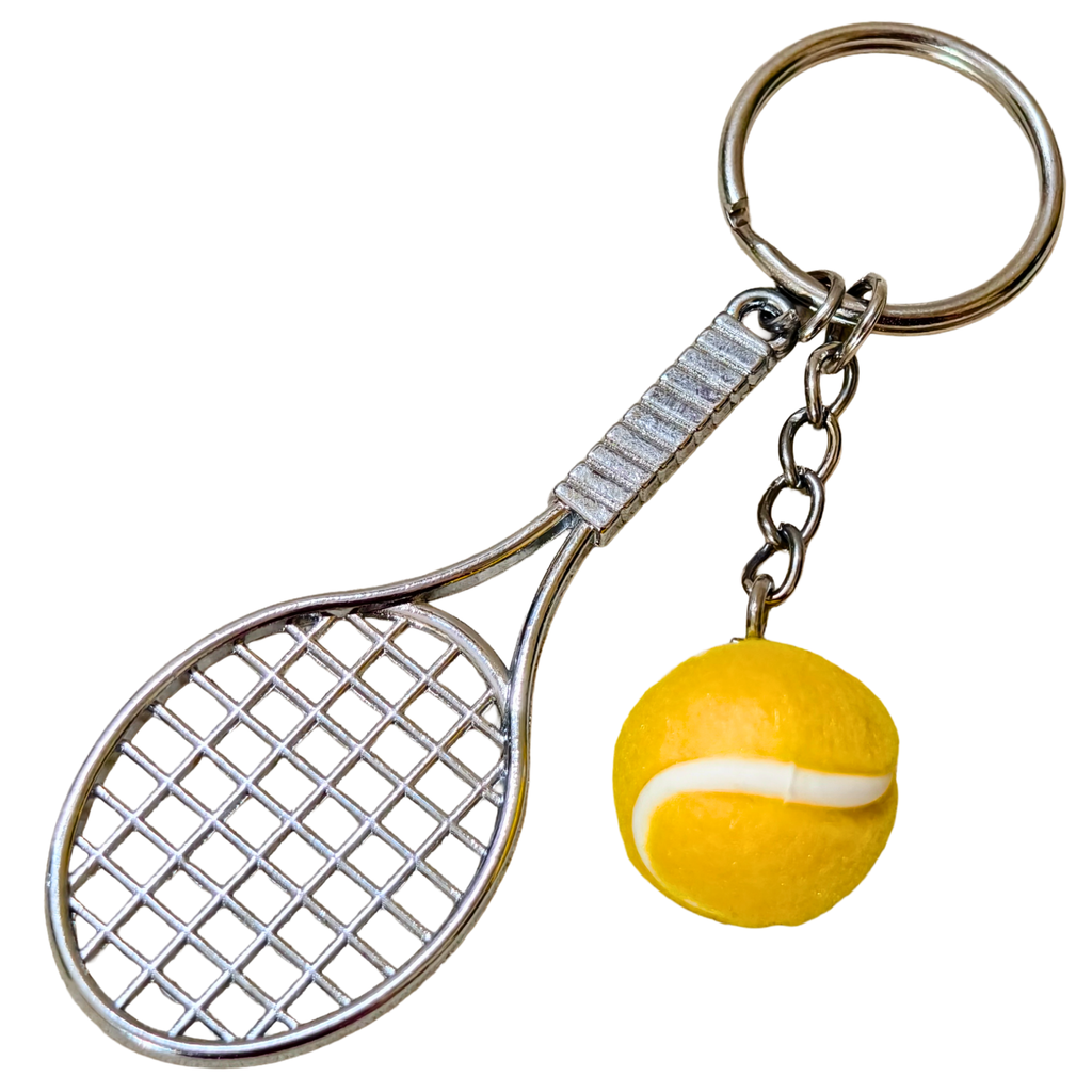 A novelty keychain featuring a miniature silver metal tennis racket and a small yellow tennis ball charm, attached to a split keyring on a plain white background.