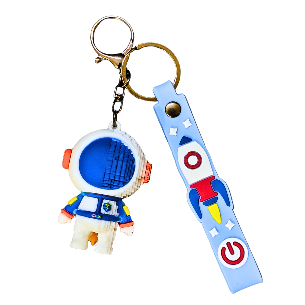 Keychain with astronaut and rocket design on a white background