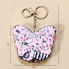 A butterfly-shaped compact mirror keychain with a pink floral and high-heel print, shown with dimension lines indicating measurements of 3.5 inches wide, 5 inches tall, and 3 inches from the clasp to the left wing.