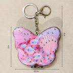 A butterfly-shaped keychain with a pink and purple seashell pattern and rhinestone embellishments, shown with dimension lines indicating 3 in height, 5 in overall height, 3.5 in width, and 3 in width.