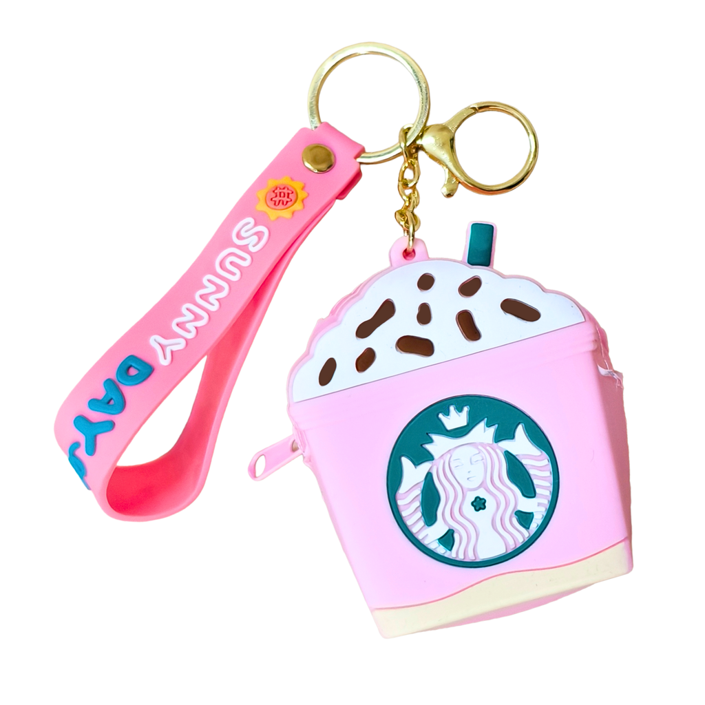 Pink Starbucks cup-shaped keychain with a strap on a white background