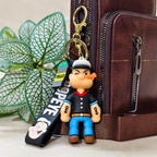 Popeye Keyring Attached With Purse As  Bag Charm On  Beige Background.
