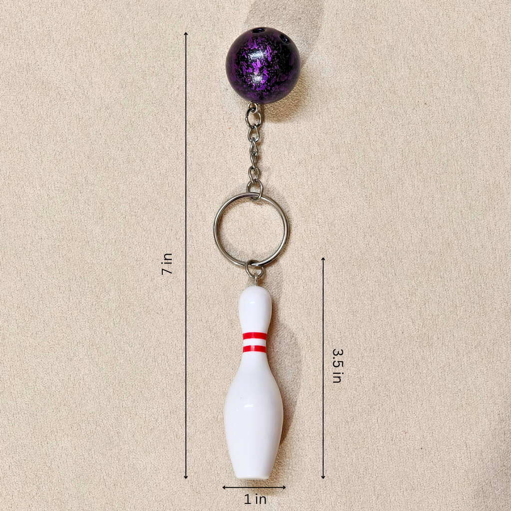 Sporty Bowling Keychain along with Silver chain and ring with Ball  showing measurements on Beige Background.