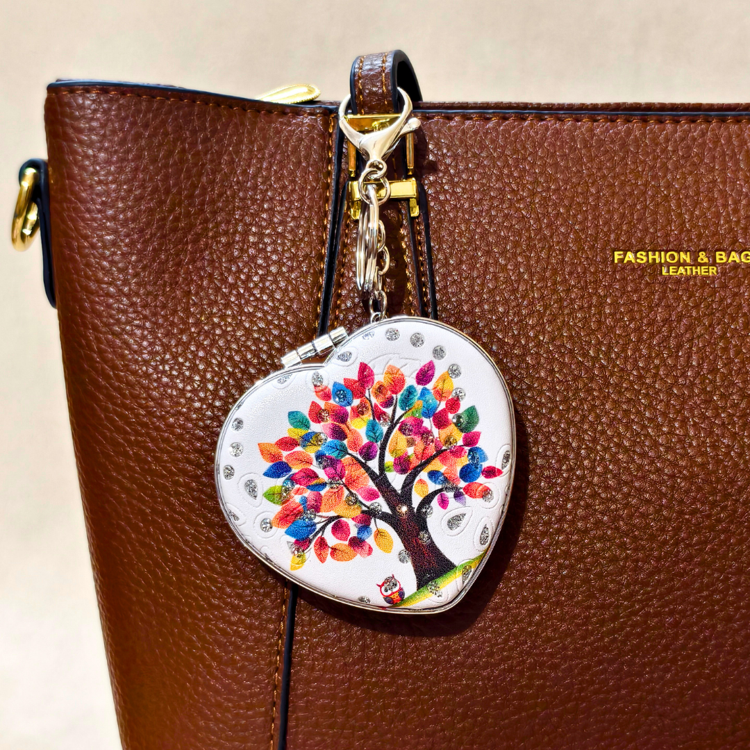 Heart Tree White Pocket Mirror Attached With Purse As  Bag Charm On  Beige Background.