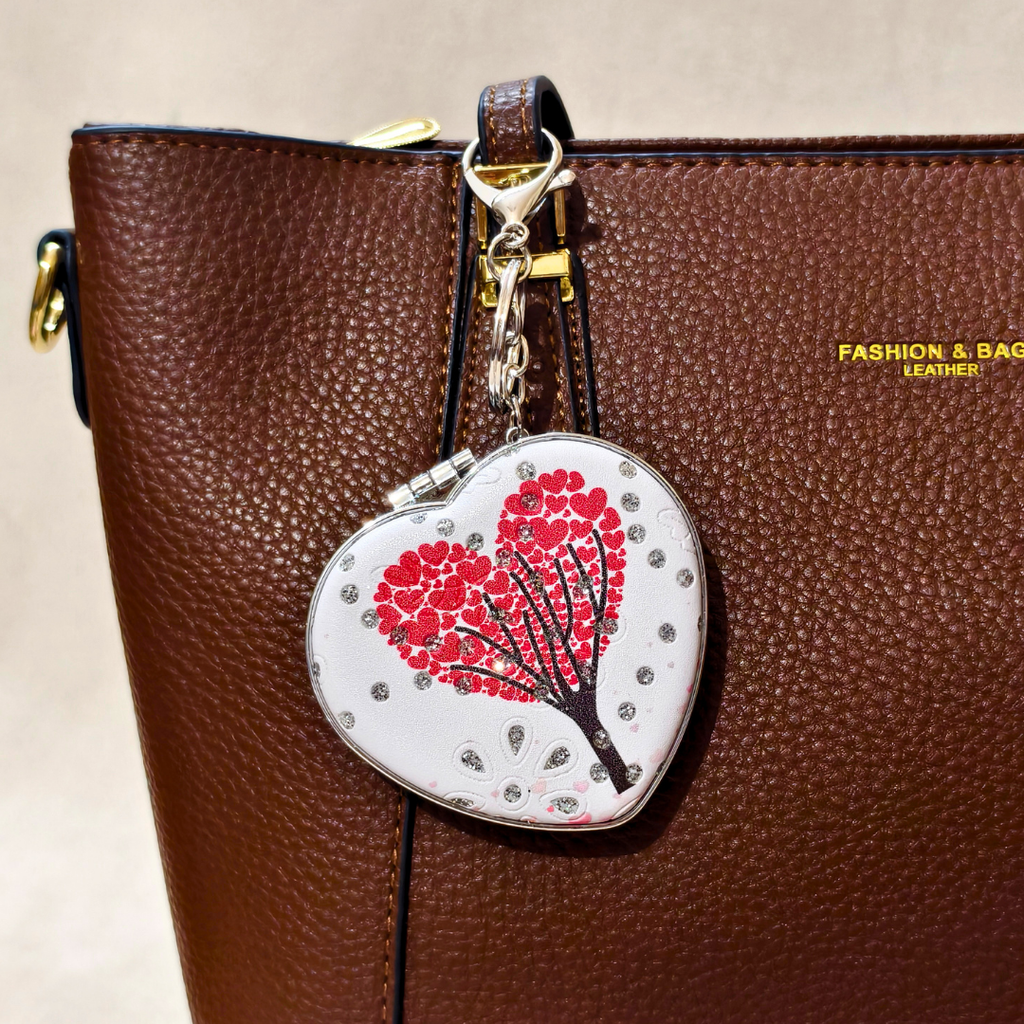 Heart Valentine White Pocket Mirror Attached With Purse As  Bag Charm On  Beige Background.