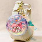 Keychain with cartoon characters on a beige background