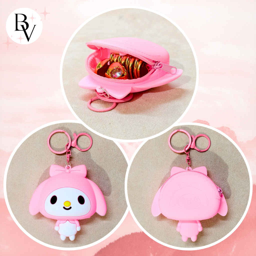 Collage of pink keychain and pouch with cartoon character design on a light pink background.