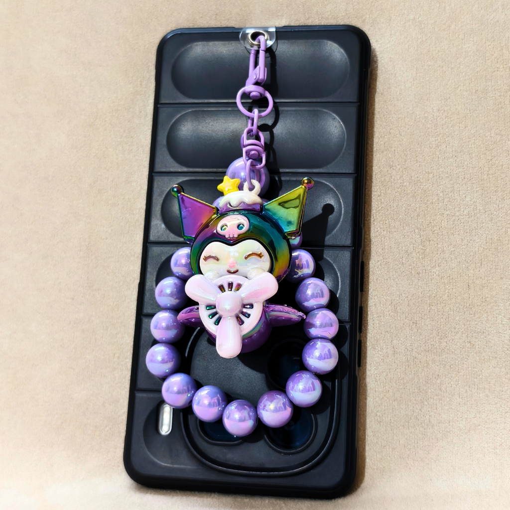 Phone case with a colorful character charm and purple beads on a beige background