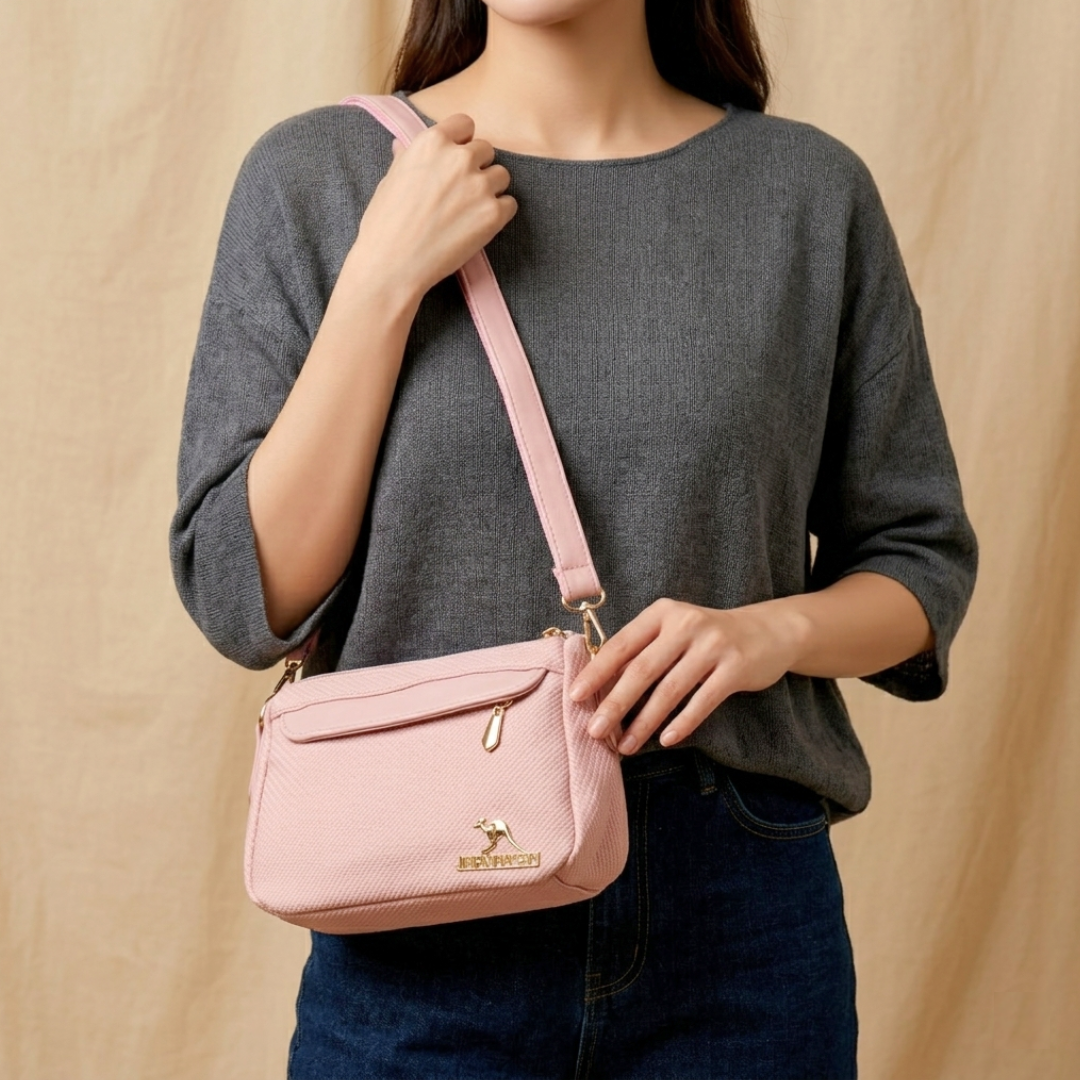 Person holding a pink handbag with a beige background