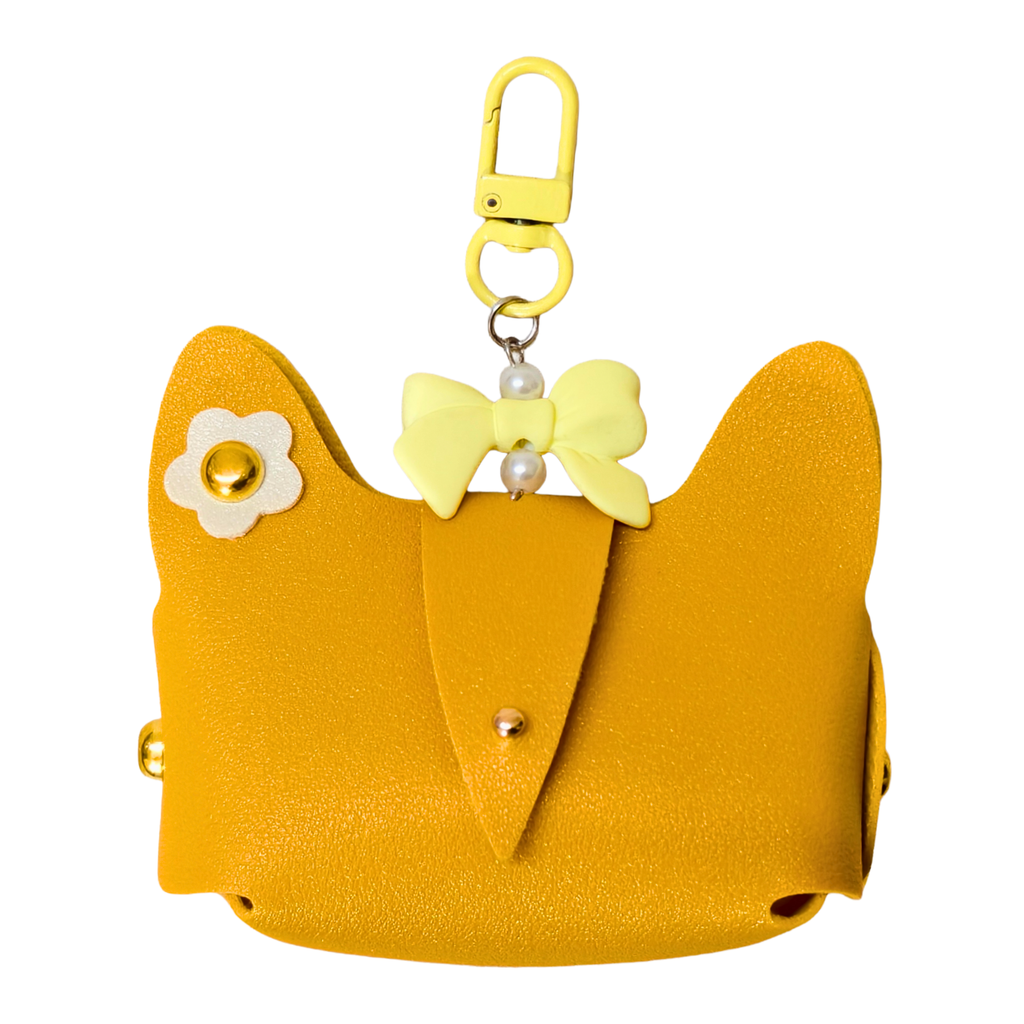 Yellow cat-shaped pouch with a bow and flower accessory on a white background