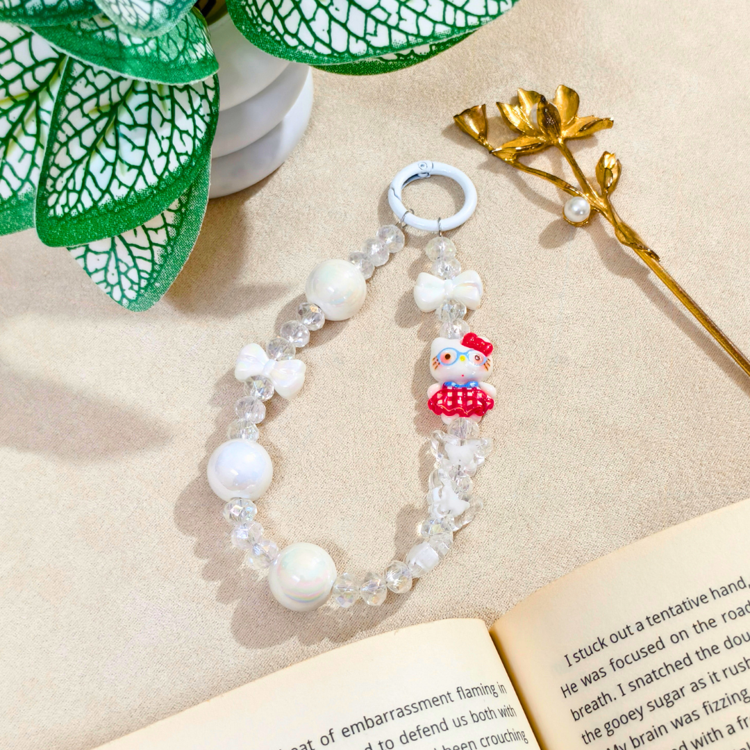 Beaded bracelet with a character charm on an open book