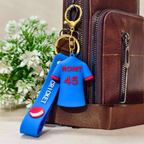 
Rohit Keyring Attached With Purse As  Bag Charm On  Beige Background.