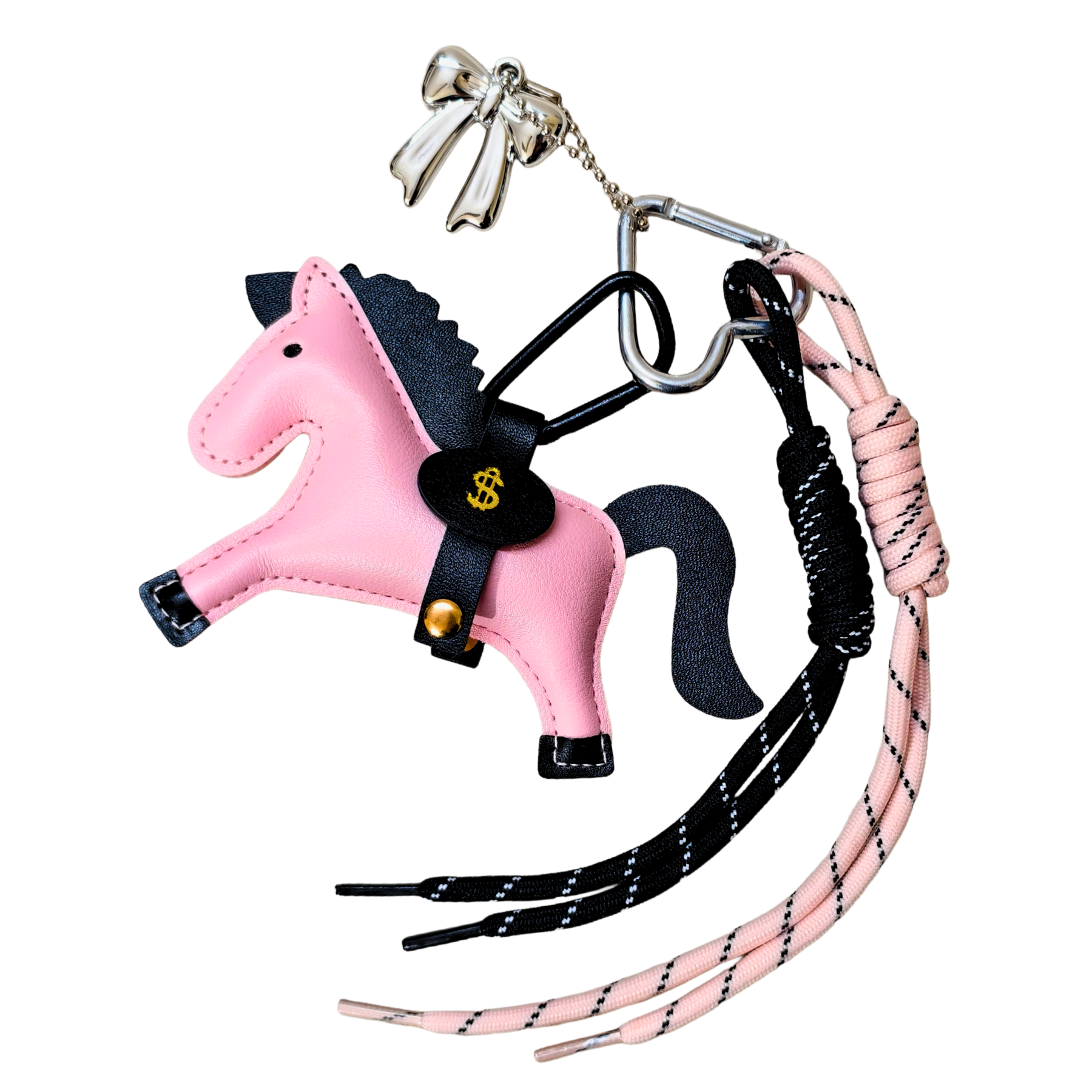 Pink horse-shaped keychain with black reins on a white background