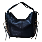 Black leather handbag with gold rings on a white background
