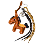 Brown horse-shaped keychain with a bridle and decorative elements on a white background