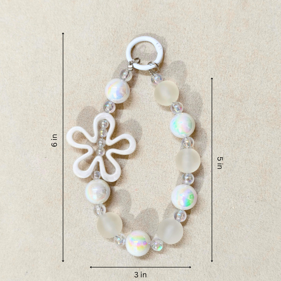 Bracelet with a flower charm and measurements on a beige background