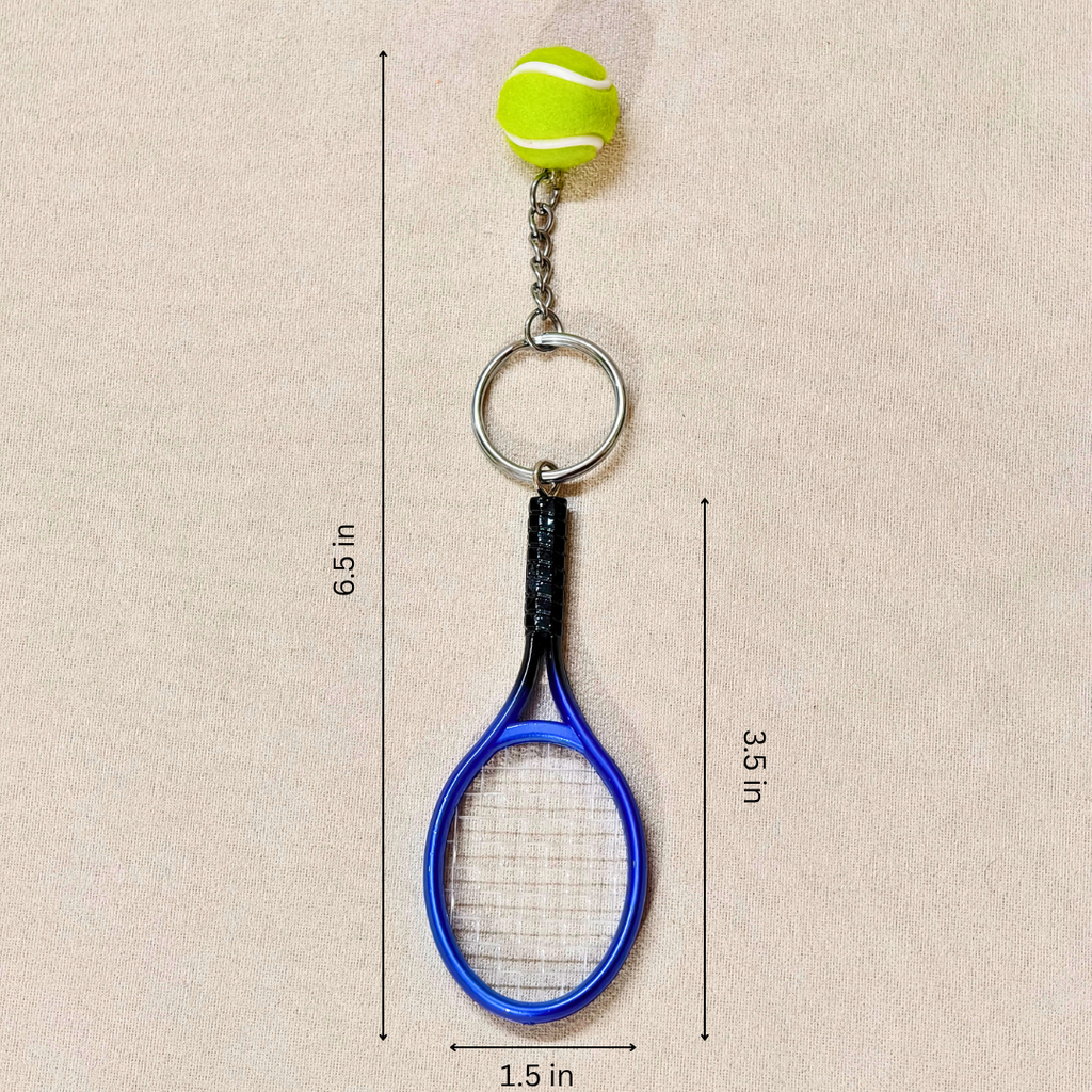 A miniature tennis racket keychain with a small yellow tennis ball charm, showing measurements against a neutral beige background.