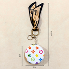 Round LV White Pocket Mirror  With Measurements On  Beige Background.